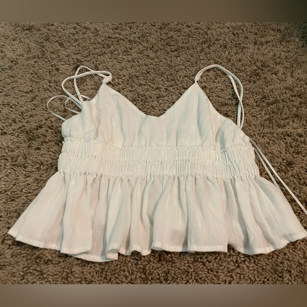 white frilly cropped top